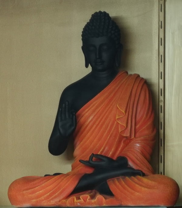 Enhance your home and garden with this graceful vintage reproduction of a Buddha statue, symbolizing peace and harmony. The statue is in a meditating lotus pose, showcasing a unique quality of Buddha.